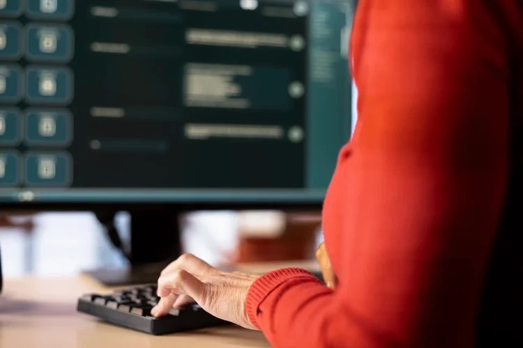 AI chatbot application displayed on a desktop computer for solutions, helping streamline text based tasks. Woman showcases digital innovation, automation and machine learning for seamless support.