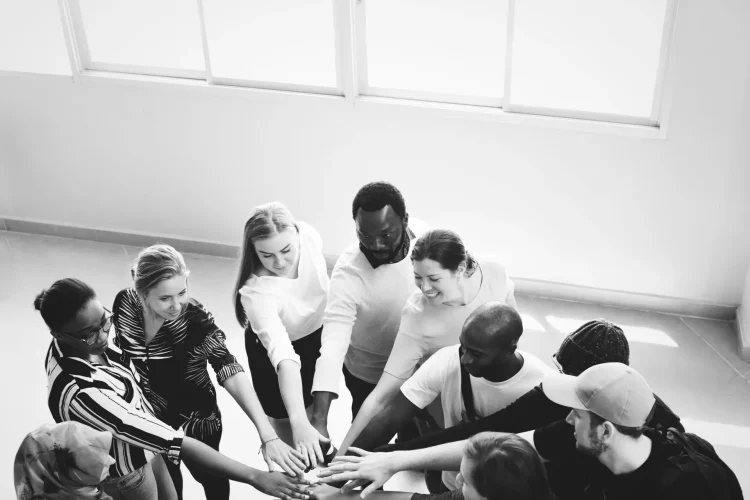 Diversity teamwork with joined hands